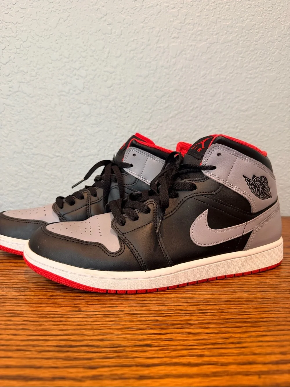 Air Jordan 1 Mid Sneakers in Black, White, Cement Gray and Fire Red